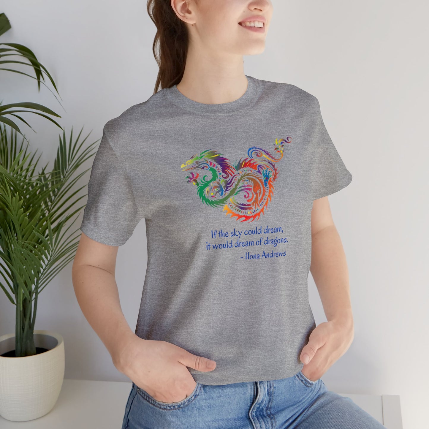 Dream of Dragons Short Sleeve Bella+Canvas T-shirt, Light Colors, Ilona Andrews Quote: "If the sky could dream, it would dream of dragons."