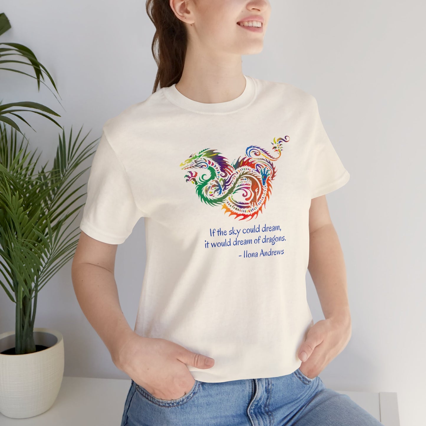 Dream of Dragons Short Sleeve Bella+Canvas T-shirt, Light Colors, Ilona Andrews Quote: "If the sky could dream, it would dream of dragons."